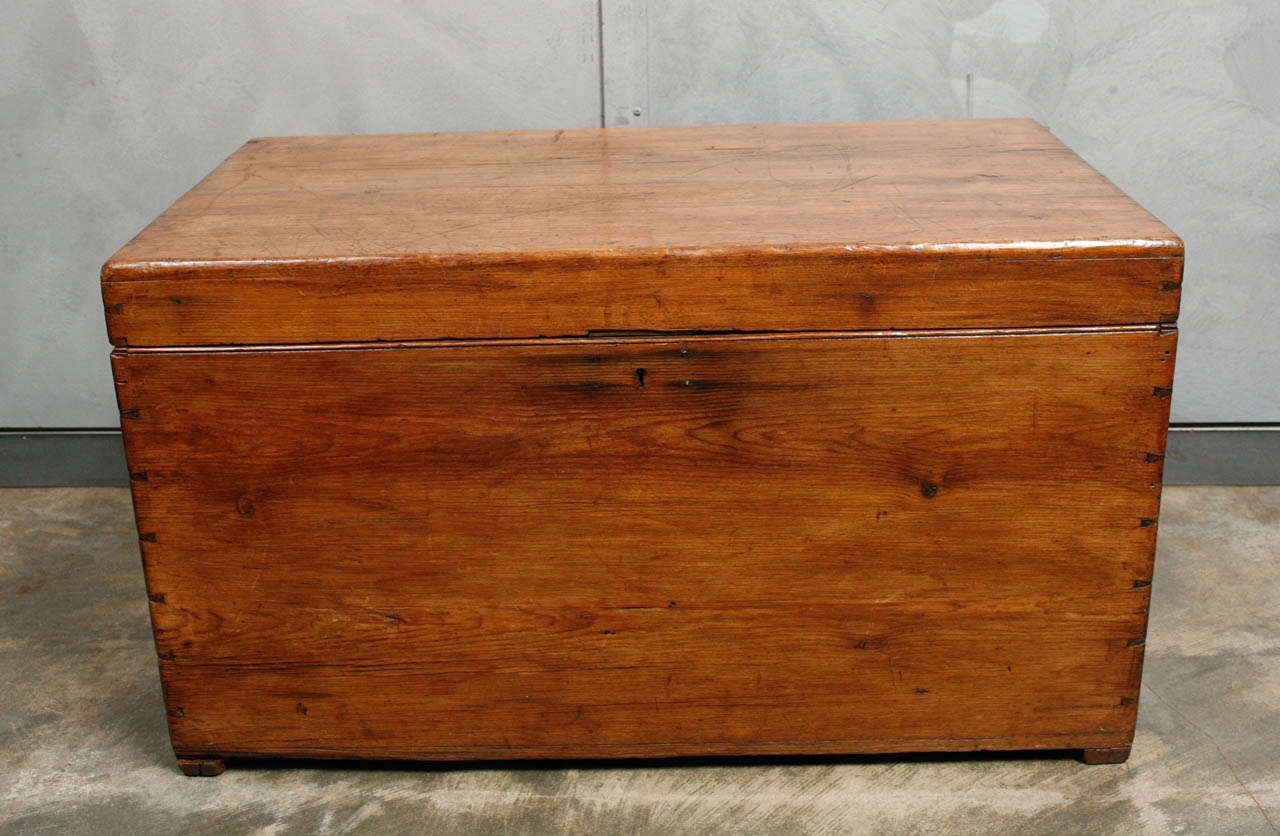 This wonderful pine wood chest is a solid piece of late 19th century craftsmanship. It has dovetailing construction, iron handles and brass hinges and lock with the four lever brand marking. There is marking of 'Hand Made' with a makers name that we