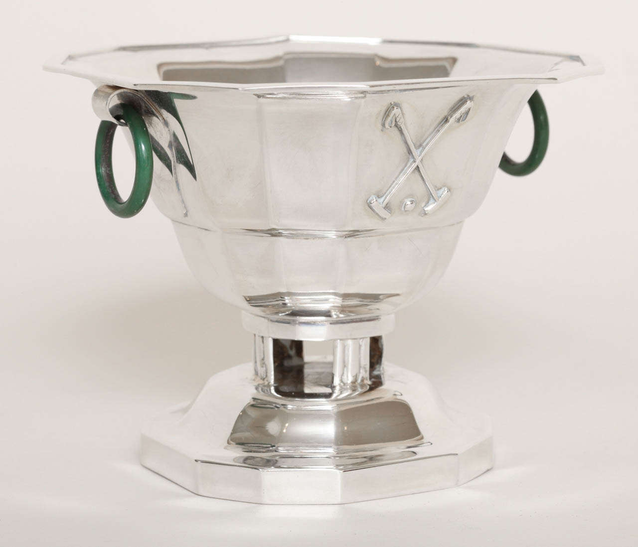 Octagonal sterling silver coupe mounted on an octagonal silver base with image of crossed polo mallets and ball on one side, with two circular jade rings
8.70 oz. Gross
Hallmarks: 950 silver/ Cardeilhac/ Jacques & Pierre Cardeilhac poincon.