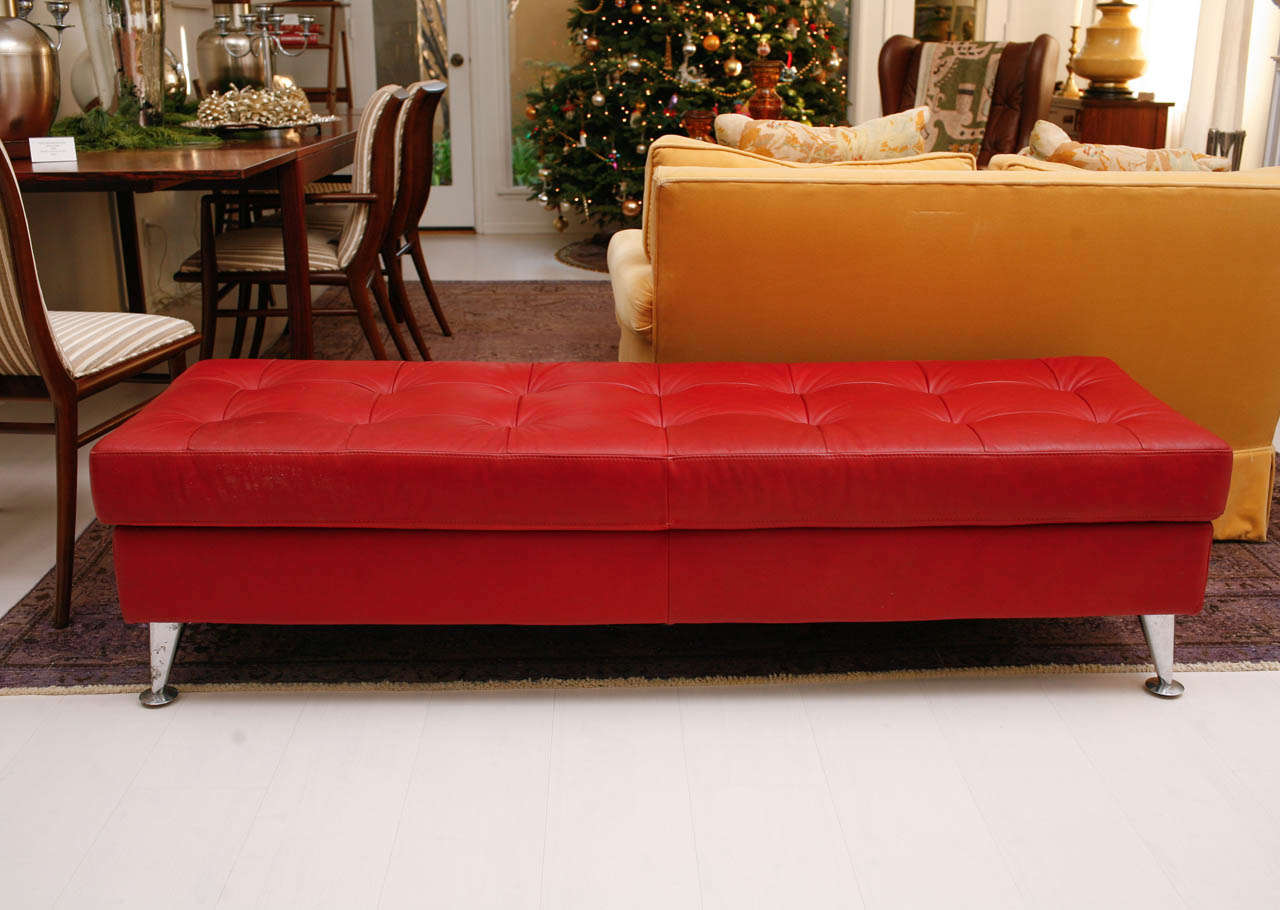 A pop of red is always and forever stylish. This vintage red leather tufted bench has tapered chrome legs, giving it an especially modern, chic feel. Perfect for a front alcove, at the foot of a bed, or in the mudroom!