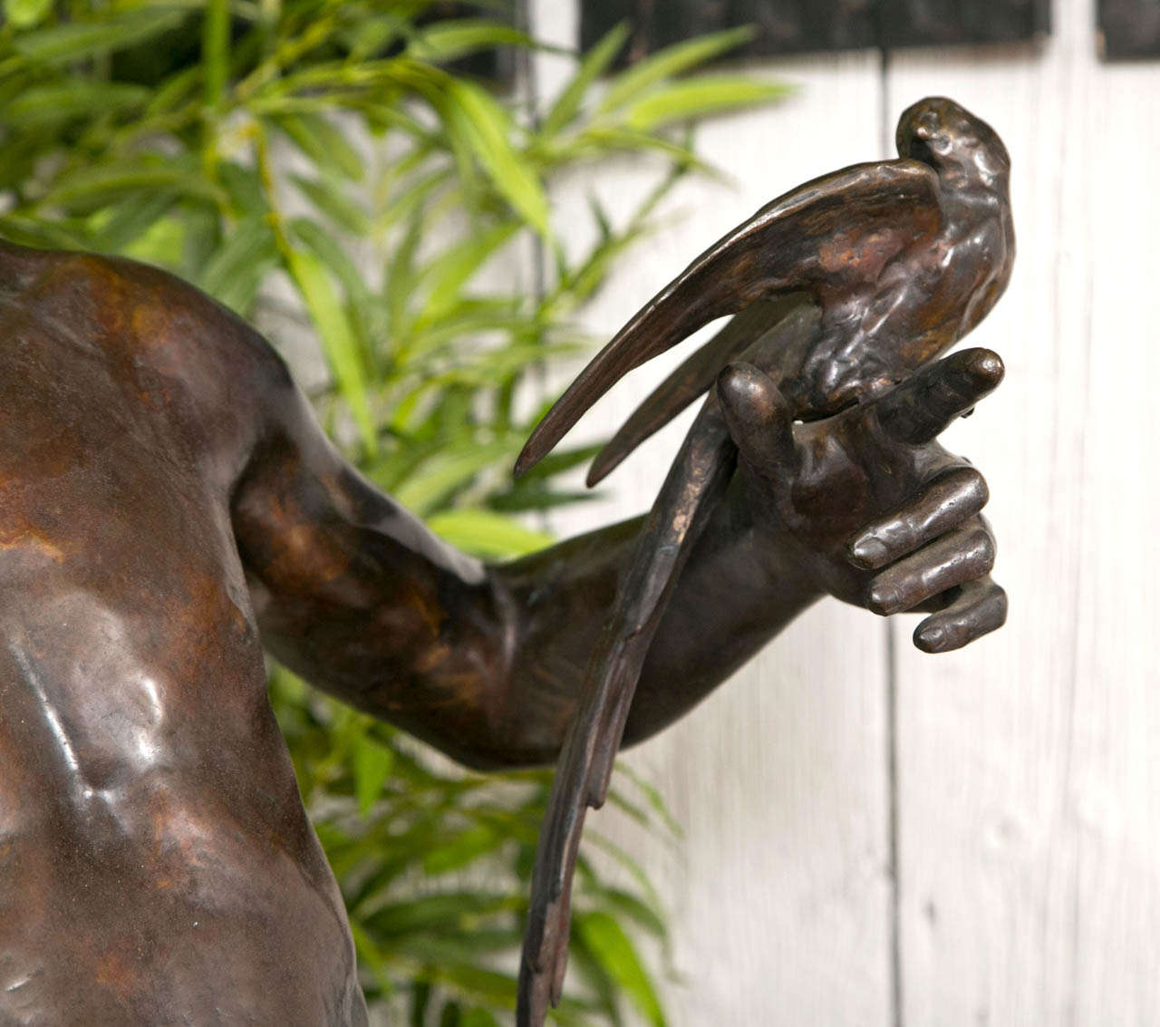 bronze sculptures bird carrying man statue