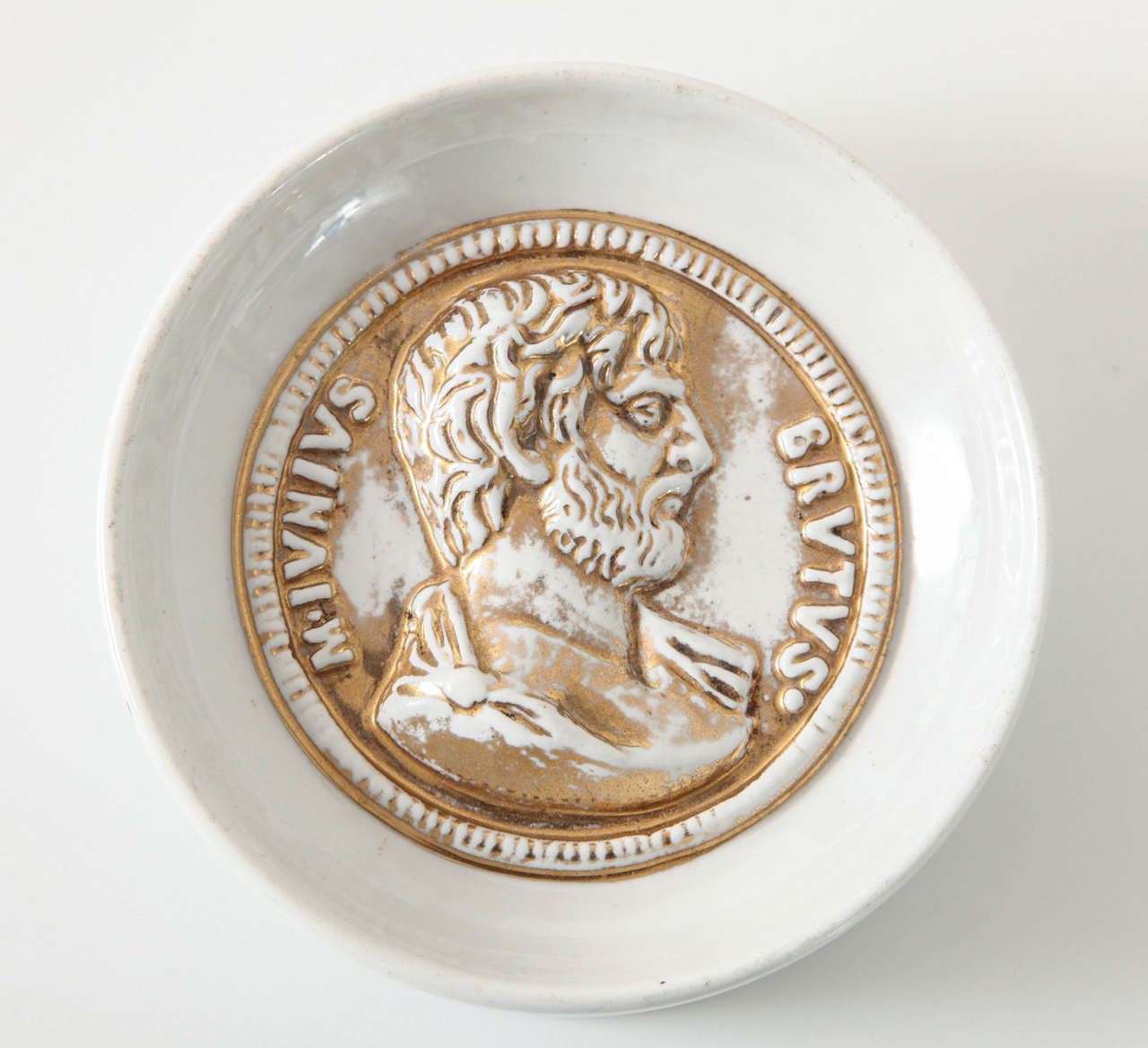 Shallow bowl made to resemble an ancient Roman coin engraved with the head of M. Junius Brutus.