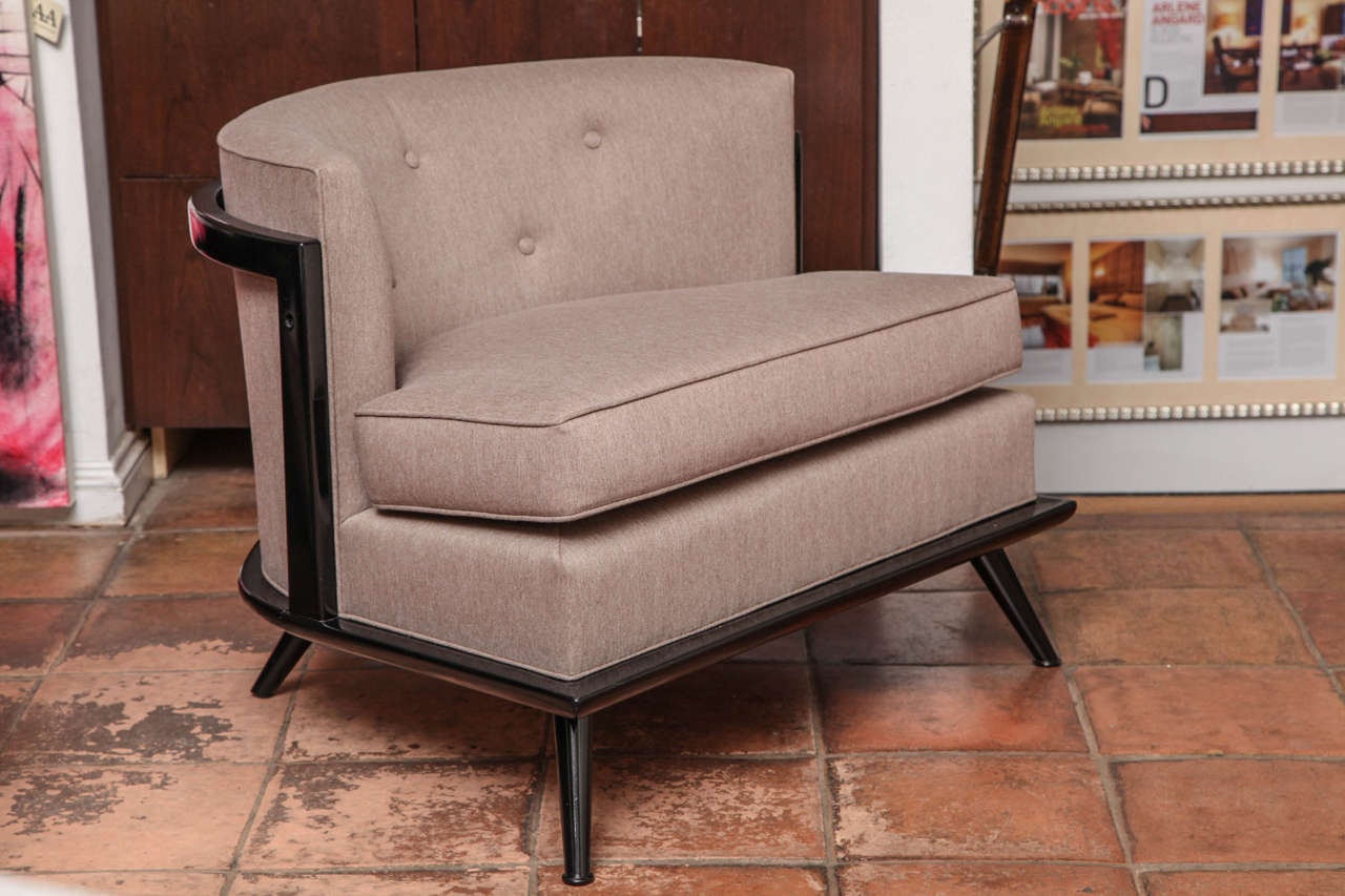 This Mid-Century Modern armchair is comfortable and classy. Its cushions were updated in taupe wool and silk textile. They complement its black walnut semi-gloss wood finish.