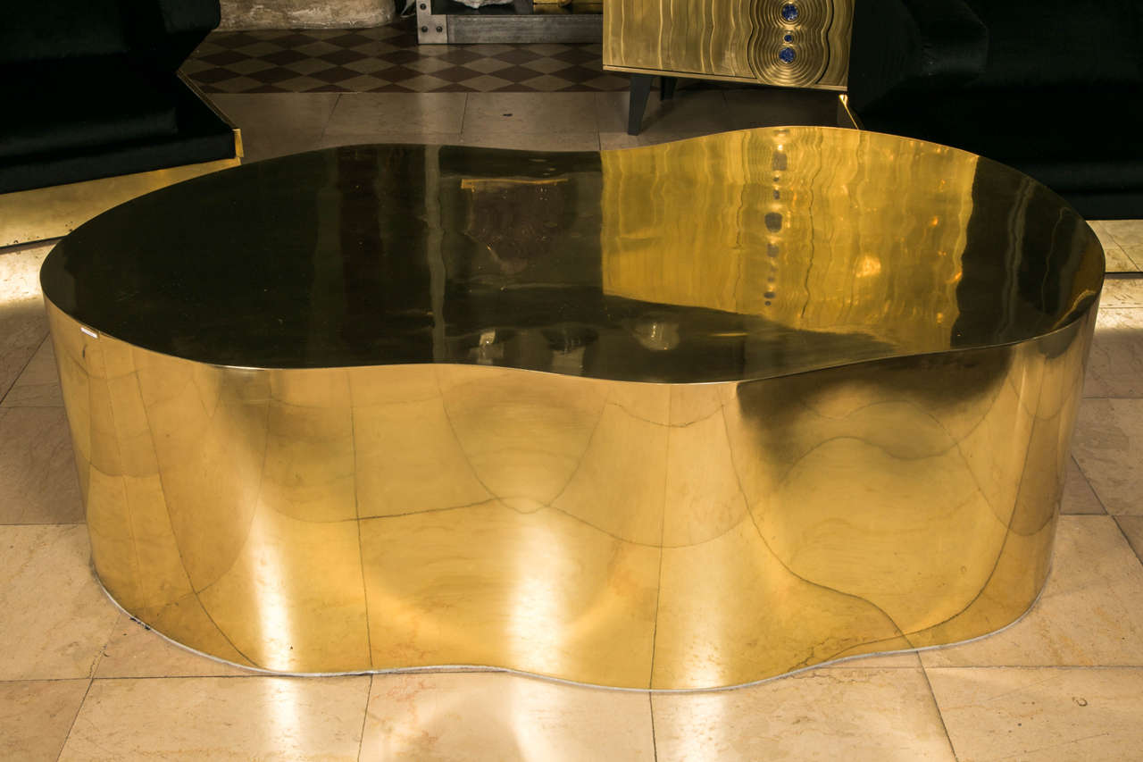 Free shape coffee table, totally covered with polished brass, set of a maximum of eight signed and numbered pieces.