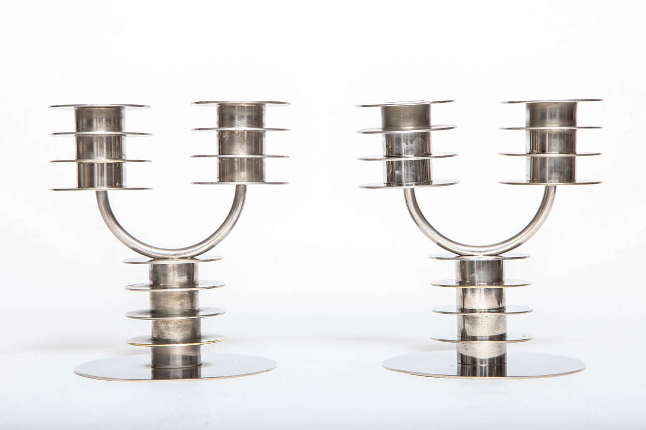 A pair of nickel-plated French Art Deco candlesticks designed by,
Marc Erol for La Cremaillere, 1930.