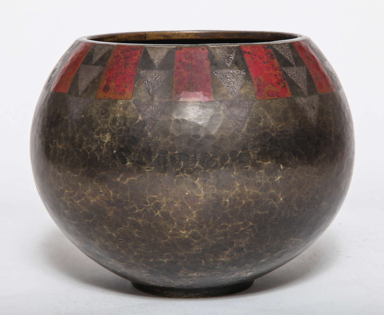 An Art Deco copper Dinanderie vase with geometric patterns of inlaid silver and rich red patinated geometric shapes. Hand-hammered. Claudius Linossier, France, signed on underside CL-LINOSIER.