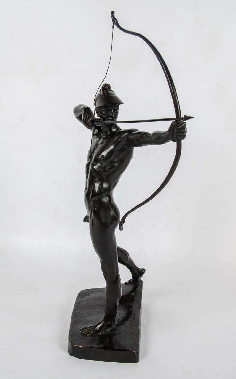 The Archer, a bronze figure by Ernst Moritz Geyger (1861-1941), depicting a muscular young Archer in full aim. Wonderful rich brown patination. Set on an integral naturalistic base.

Signed E M Geyger fec and inscribed with Gladenbeck foundry