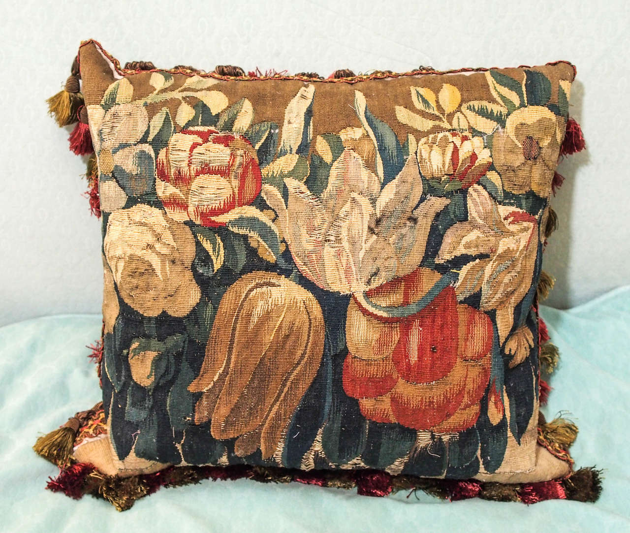 17th century Aubusson tapestry fragment depicting tulips now as cushion with silk velvet backing, trim and down inserts.
