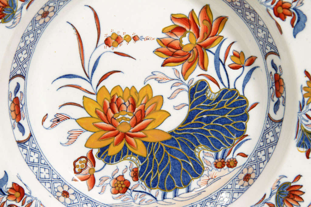 Boldly painted with lotus flowers in Classic Imari colors of cobalt, iron red and orange with two bands of diamonds. These deep dishes were painted in the workshop of James Donovan, Dublin, Ireland 1770-1829. The atelier of James Donovan (& Son)