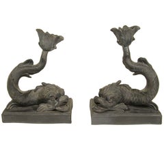 A Pair of Wedgwood Black Basalt Dolphin Candlesticks