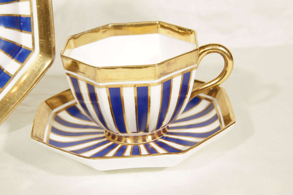 This Wedgwood set has a bold blue and white sunburst pattern of lines radiating from the center, a gilded edge and an octagonal shape. It is very much in the style of a Bloor Derby pattern from the 1830's.
