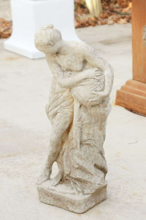 Classical female garden figure semi-nude with draped gown done in cast stone