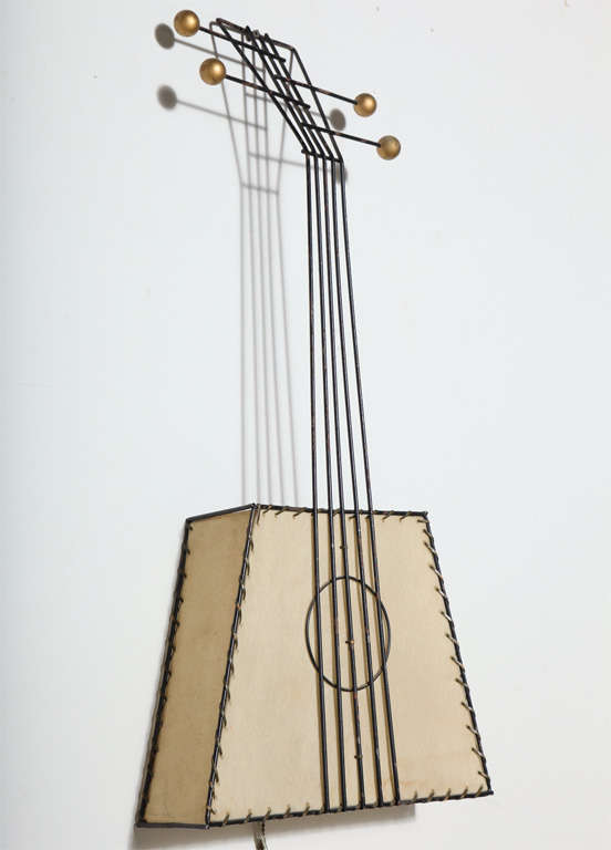 Frederick Weinberg Guitar Illuminating Wall Lamp Sculpture - Wall Hanging, 1950's. Featuring an abstract Black Wire Banjo framework and handle, warm hand stitched Parchment surface and Brass knob details. Classic. Atomic. American Mid Century 