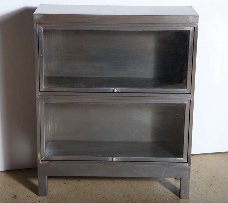 pair of restored steel Barrister Bookcases with glass fronts. Can be stacked. Multiples available with notice.  Ideal multi-use, dust free storage piece.  Great storage for small, compact space.  Can also be considered for Kitchen, Dry Bar, Linen