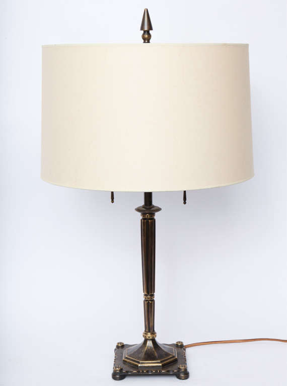 A signed Oscar B Bach patinated bronze table lamp.
Shade not included