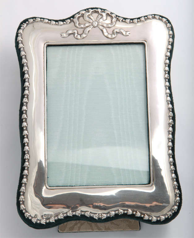 Sterling silver-mounted, dark green velvet picture frame, Chester, England, 1905, James Deakin & William Deakin - makers. Delicate floral border ends in a bow at the top of the frame. @8