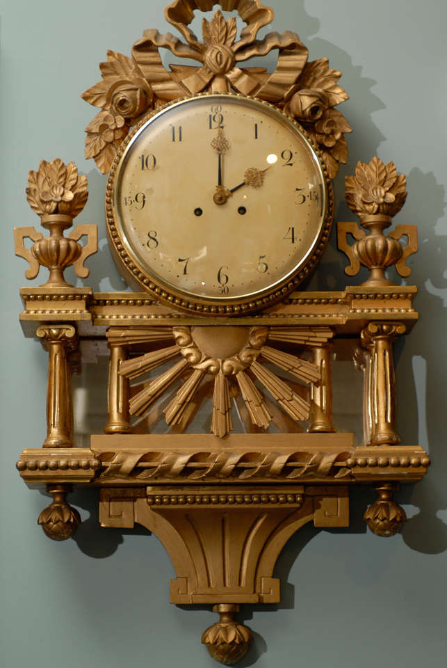 A Swedish gilt wall clock.