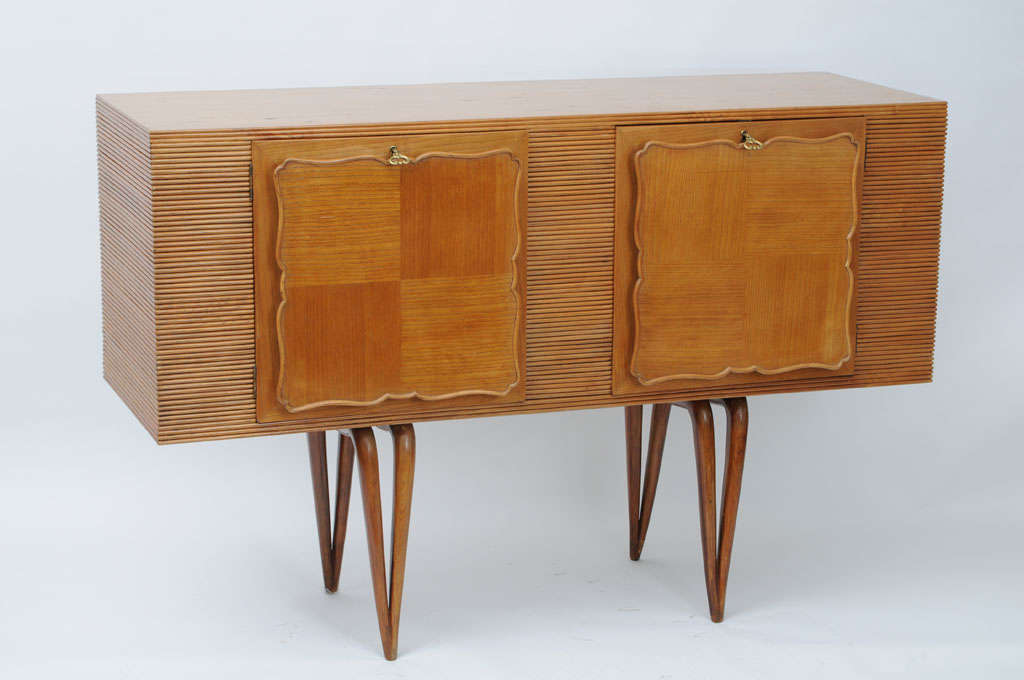 Wonderful delicate Art Deco Style little cabinet or sideboard. Great for a small space.
It has four downward tapered legs giving a very elegant impression.