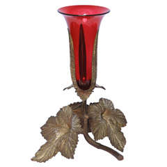 Vase with bronze vine leaf base