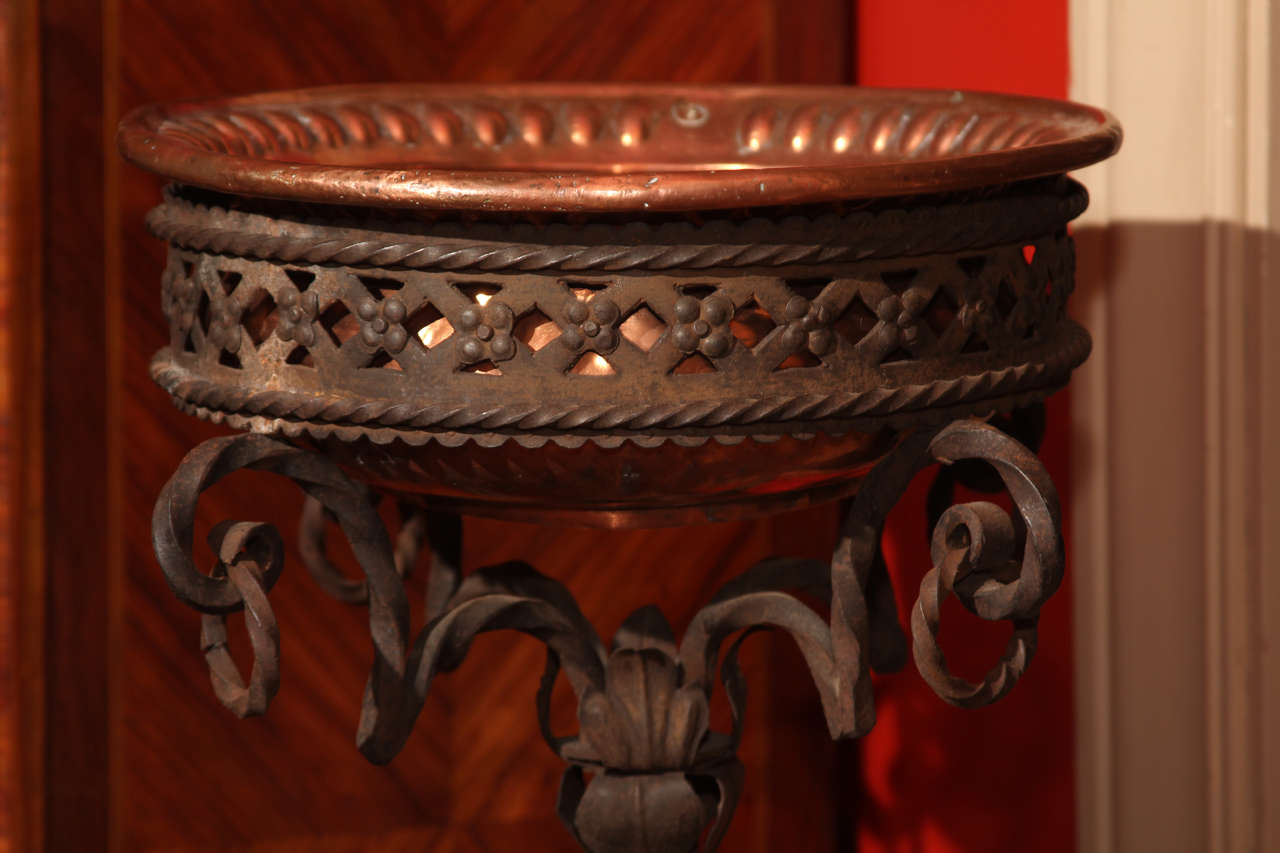 French Wrought iron Jardiniere with copper bowl.