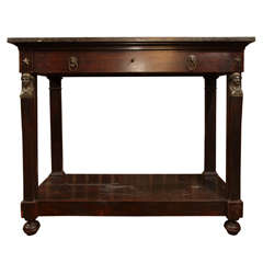 Empire mahogany and gilt console with marble top. 