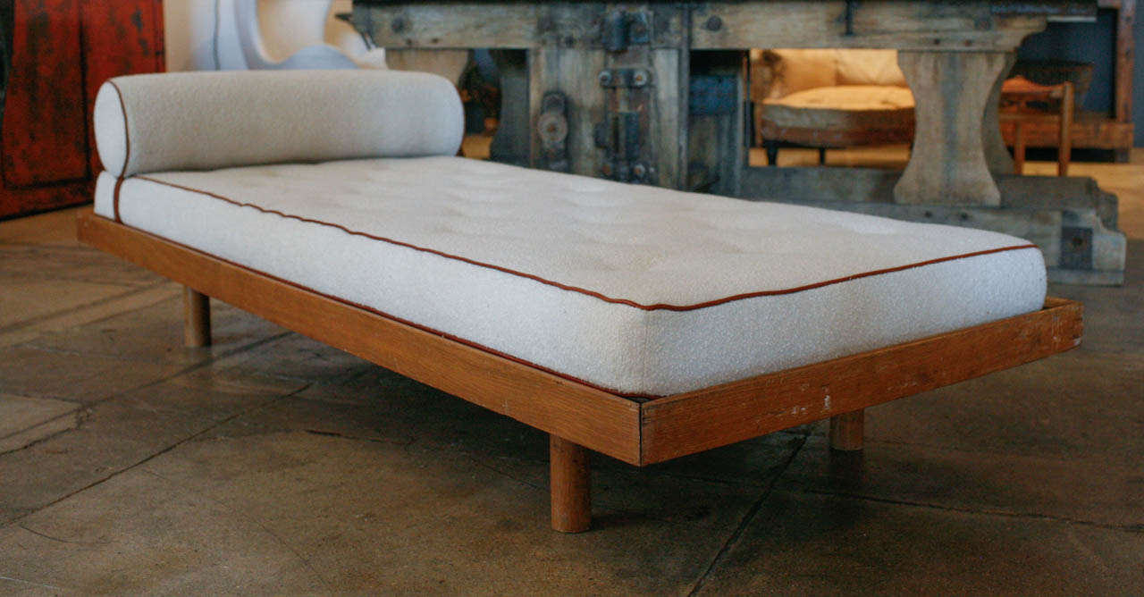 a french oak daybed by charlotte perriand , produced in the late 1950's.