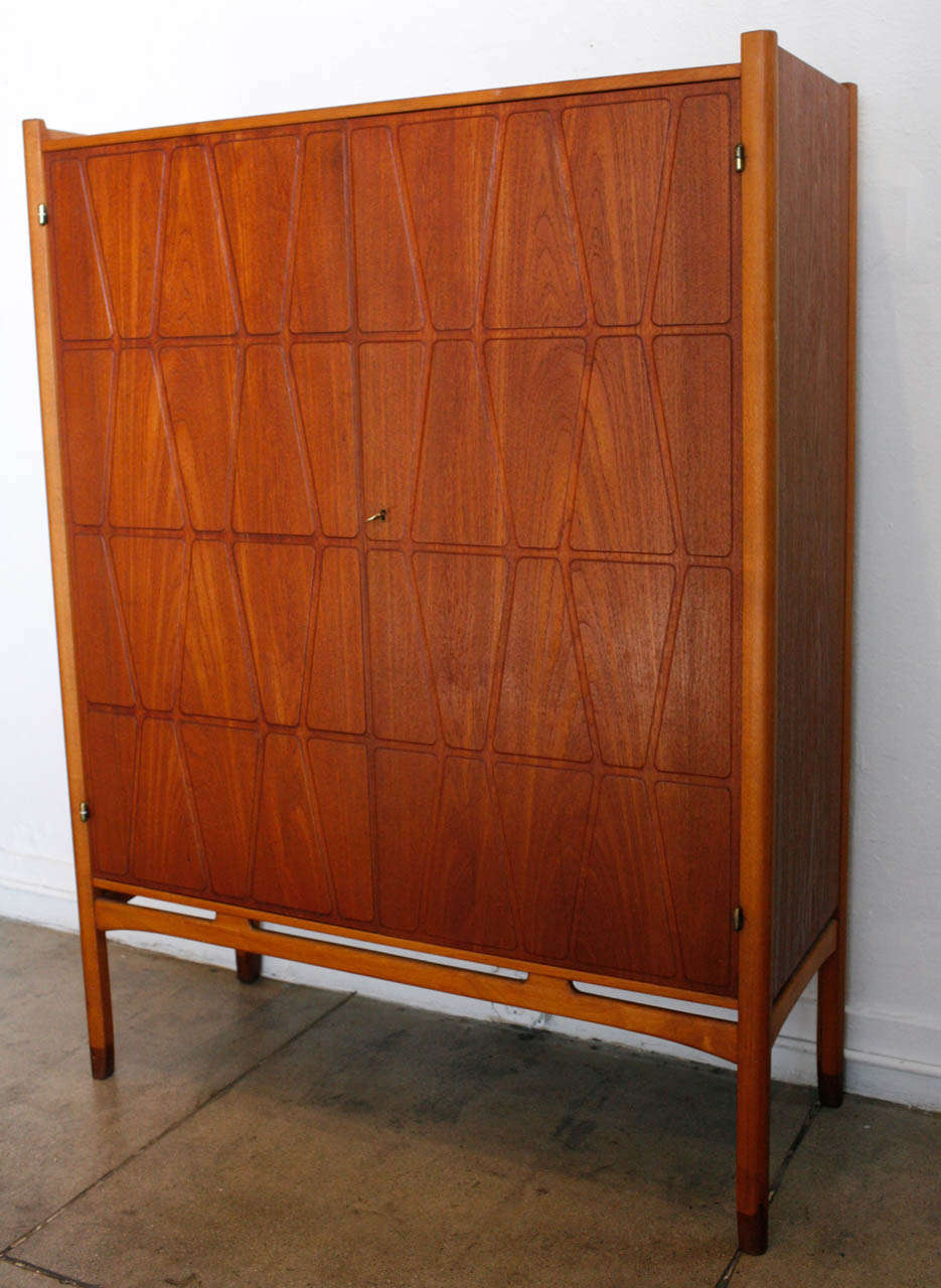 A teak & oak armoire by swedish designer, Yngve Ekstrom.
