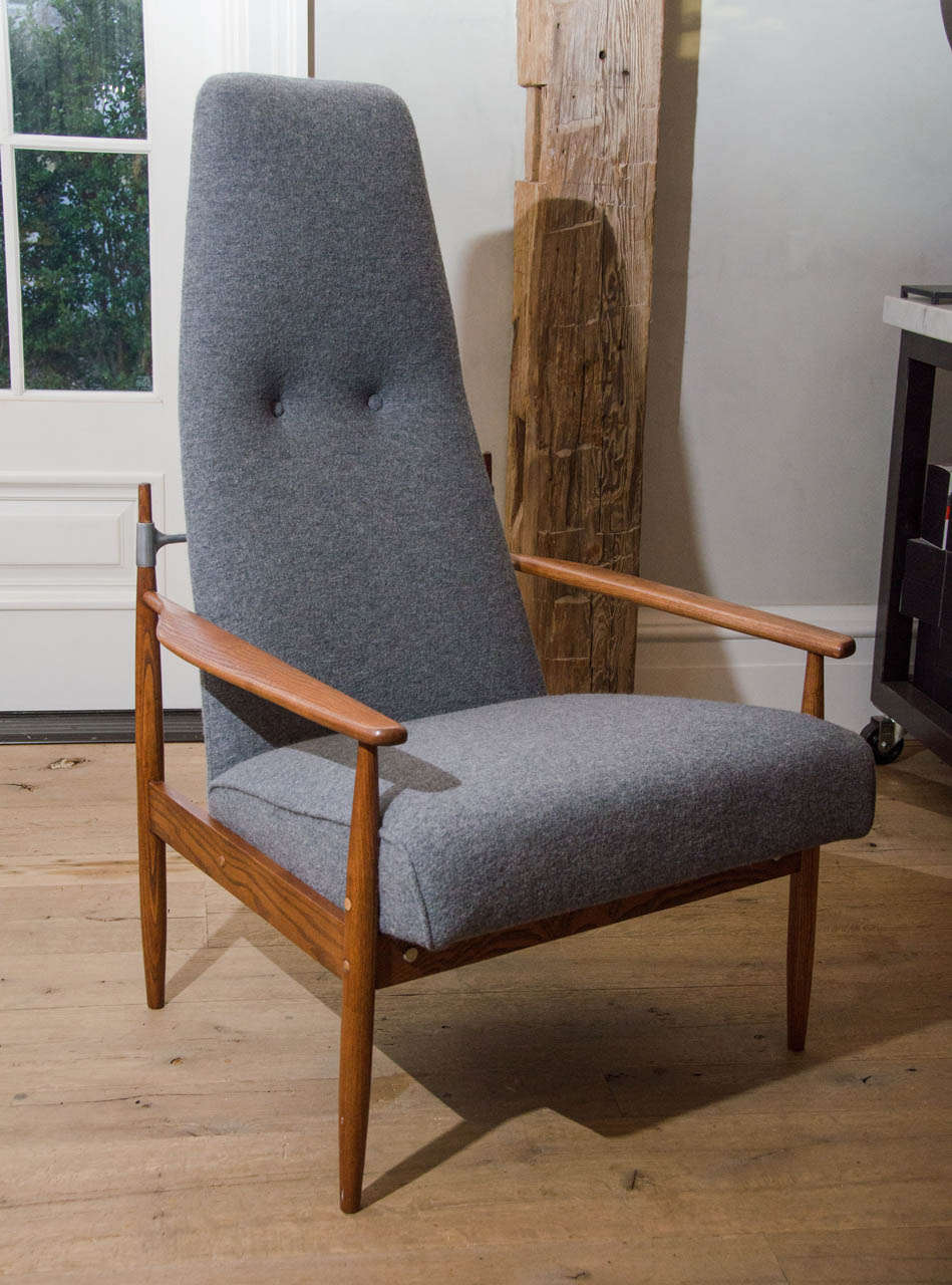 Stunning pair of Danish midcentury Peter Hvidt tall lounge chairs newly re-upholstered in grey flannel.