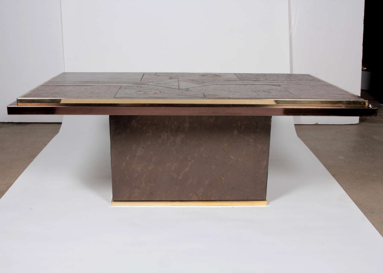 Coffee table by Paul Kingma, stone, brass, copper and coins.