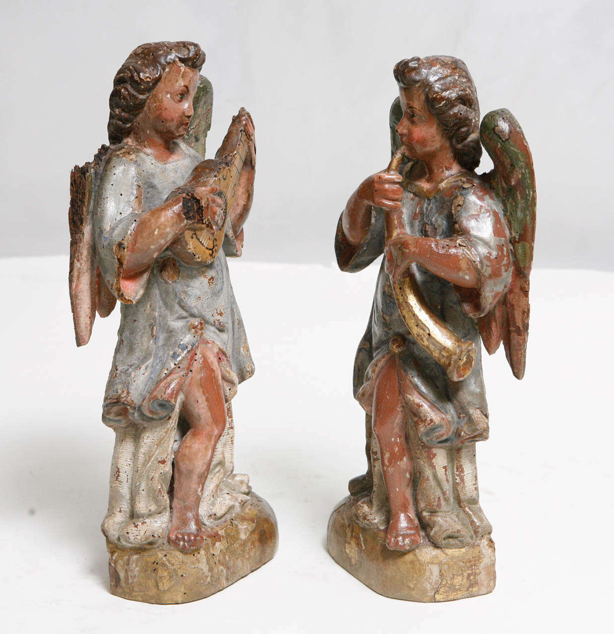 18th c. Pair of Italian Polychromed Winged Angels playing Instruments. The base measures 5.5 inches