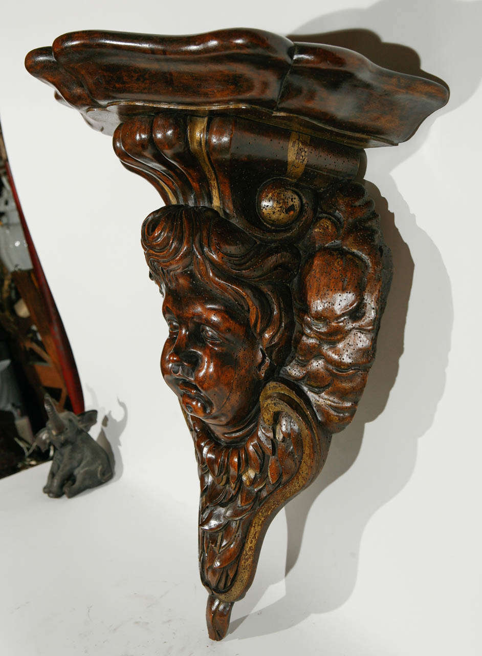 19th century Italian Carved Cherub Head in Walnut Wall Mounted Console.