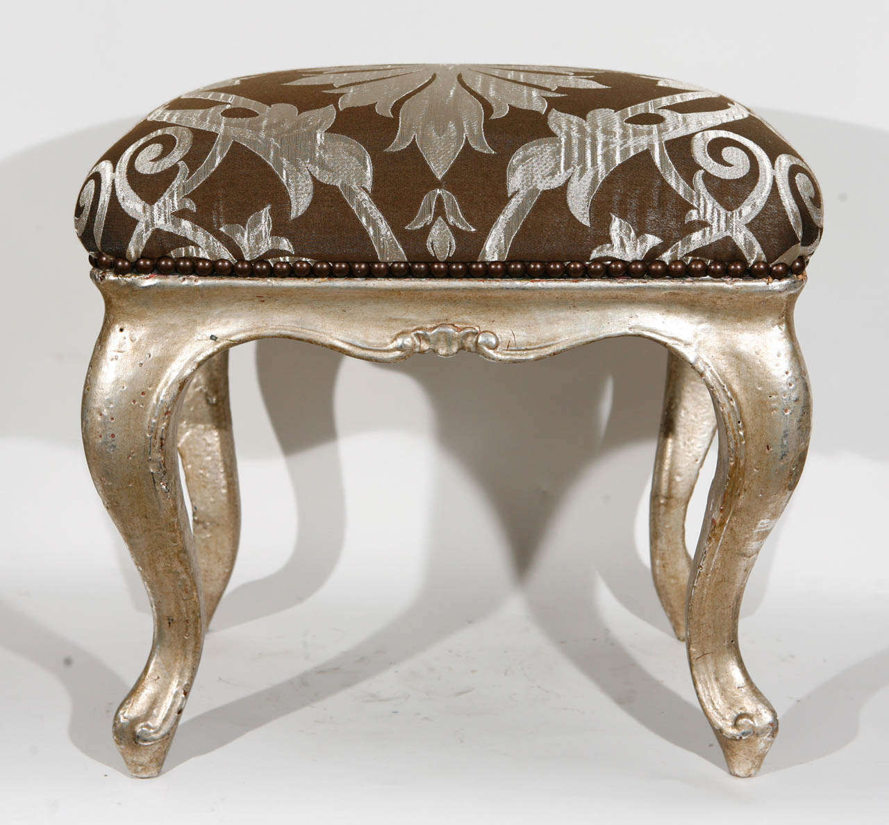 Pair of 18th century Venetian carved wood stools with silver leaf.  The silver leaf is not original.