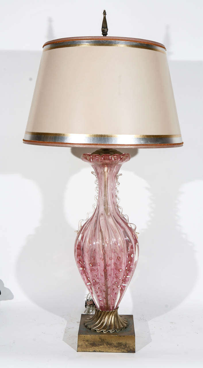 Pair of Midcentury Pink Murano Lamps with Gold Flecks. The bronze bases are original. The shades are included and are hand made of parchment paper. They are hand gilded and decorated. The lamps have been newly wired.
Additional measurements:
Top