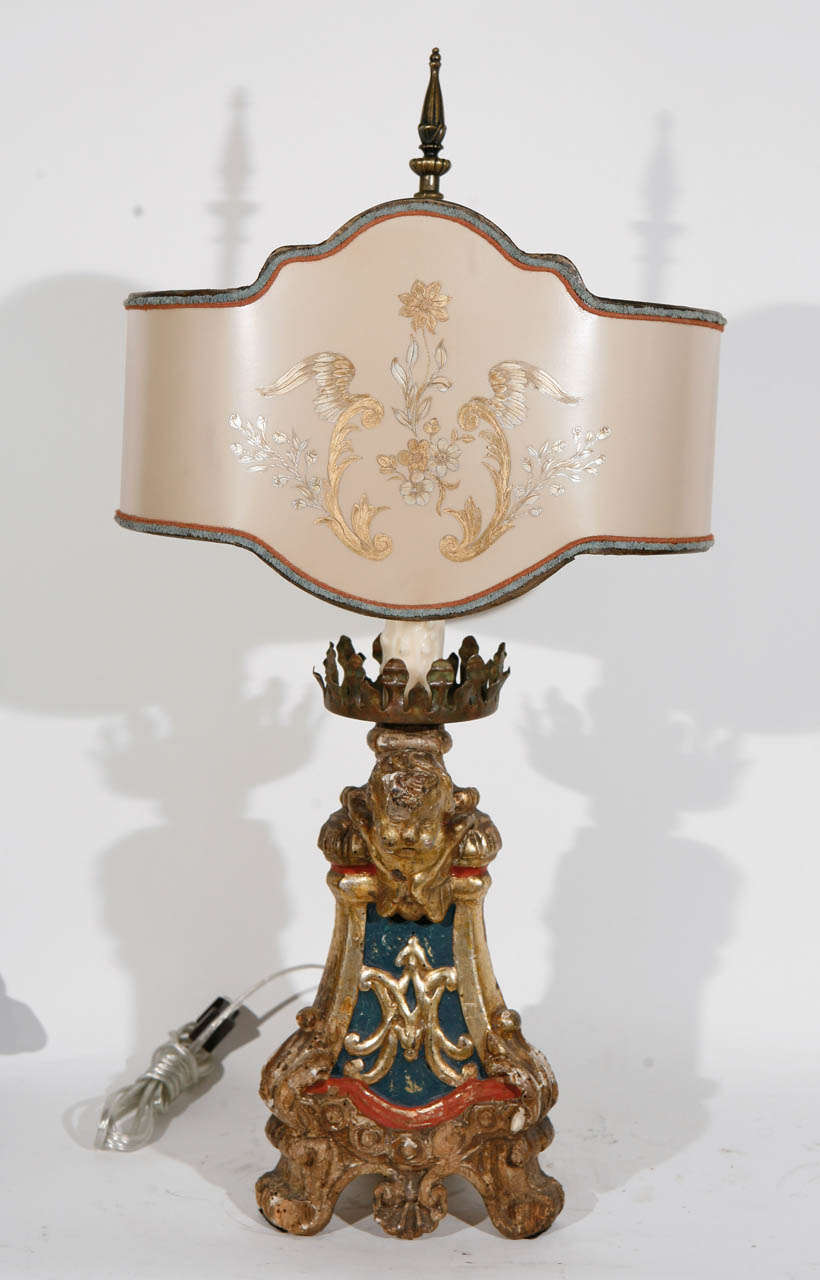Single 18th c. Italian Giltwood and Polychrome Candlestick converted to Lamp. The base measurement is 7 inches. The Shade is included and is Hand Made of Parchment Paper. It is Hand Gilded and Decorated. The lamp has been newly wired.