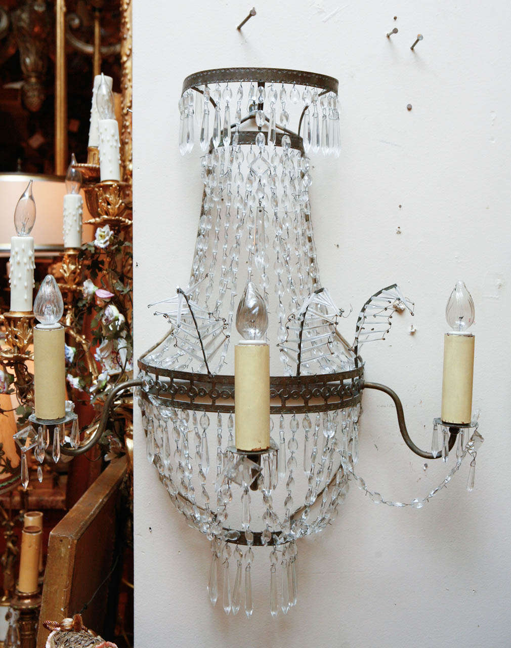 A group of four 1920s French Crystal Regency Style Sconces.  The sconces have been newly wired.