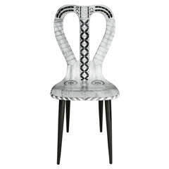 A "Musicale" Chair by Atelier Fornasetti.