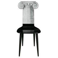 A Chair by Atelier Fornasetti.
