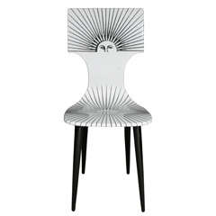 A "Sole" Chair by Atelier Fornasetti.