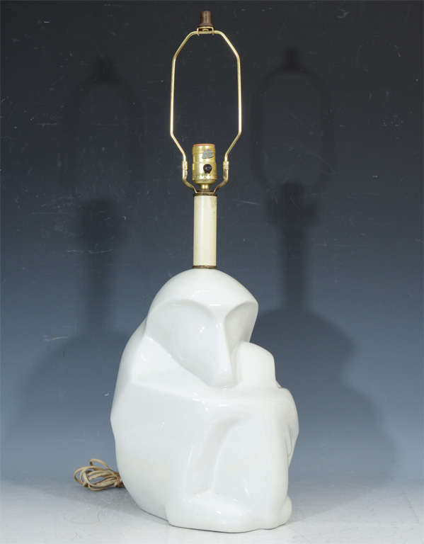 A vintage white glazed porcelain lamp in the form of a seated baboon.

4866