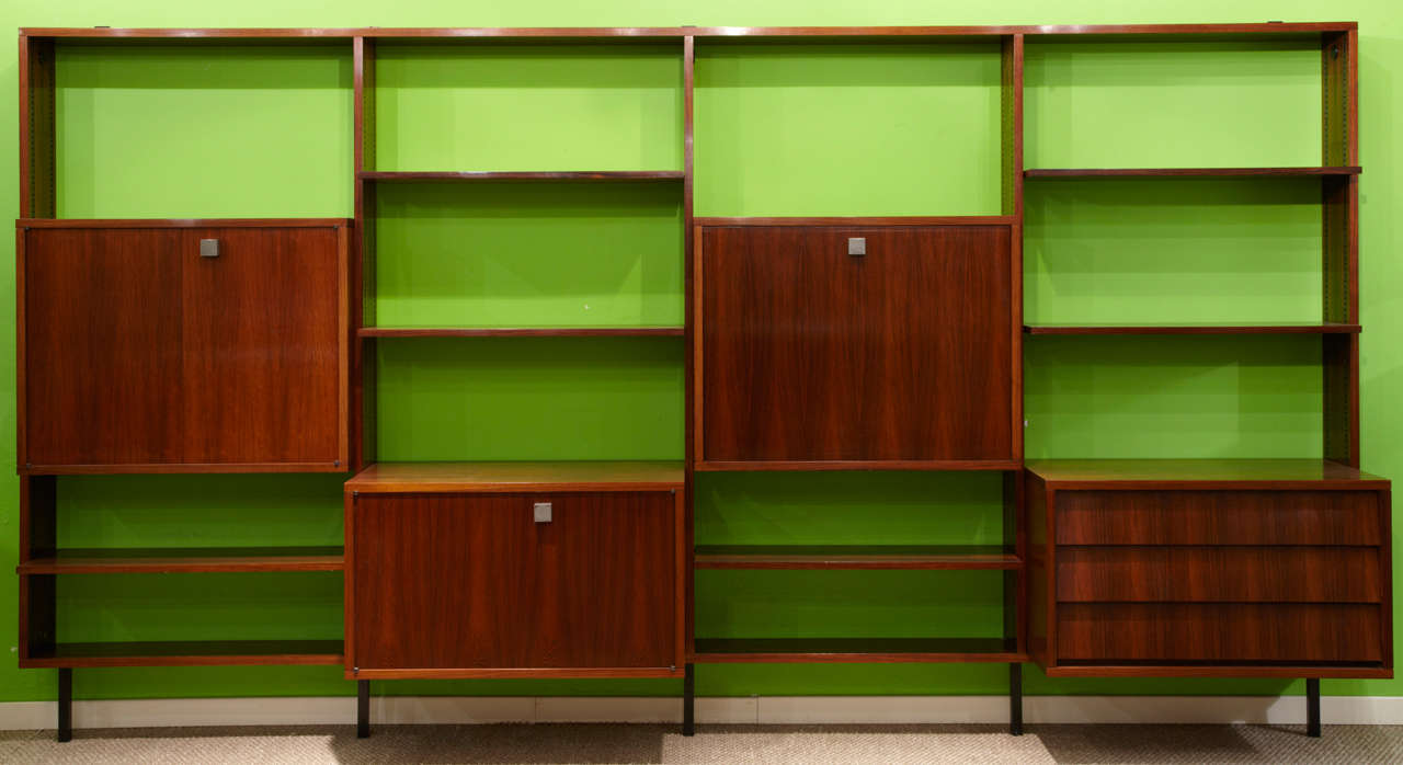 A very rare rosewood wall unit from belgian architect, Alfred Hendrickx, circa 1968.

Complete and all original parts. The shelves and compartiment boxes are adjustable in different heights. High quality mateials and very light montage.