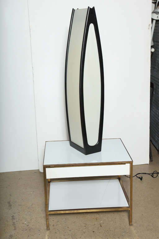 Rare Scandinavian Modern designed black ebonized teak and off-white perspex Modeline table lamp or floor lamp. Features sleek, sculptural, environmental lighting. Two bulbs; three settings. Warm glow when illuminated. 
Great lamp for any room. Made