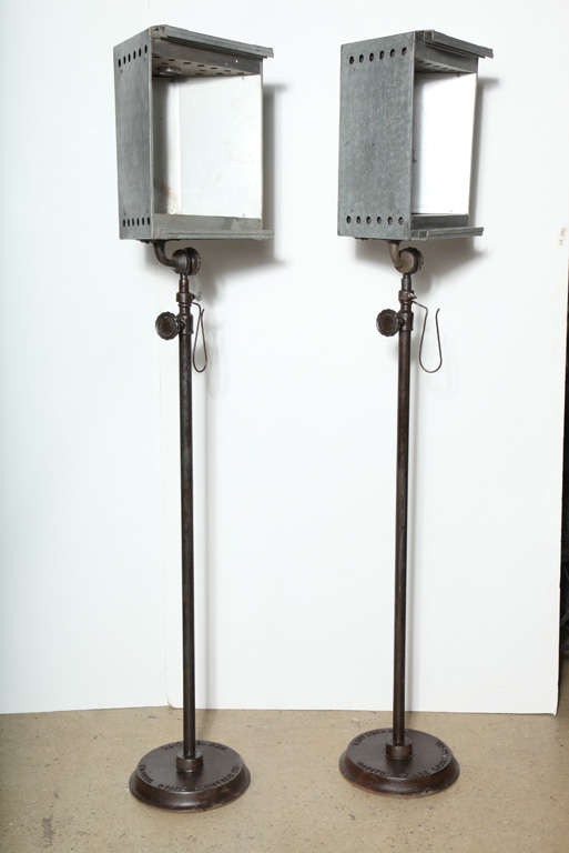 2 restored Capitol Stage Lighting Co., New York City adjustable Theater Lights on sturdy Cast Iron base, adaptable for regular or high wattage light bulbs.  Can raise to 10'