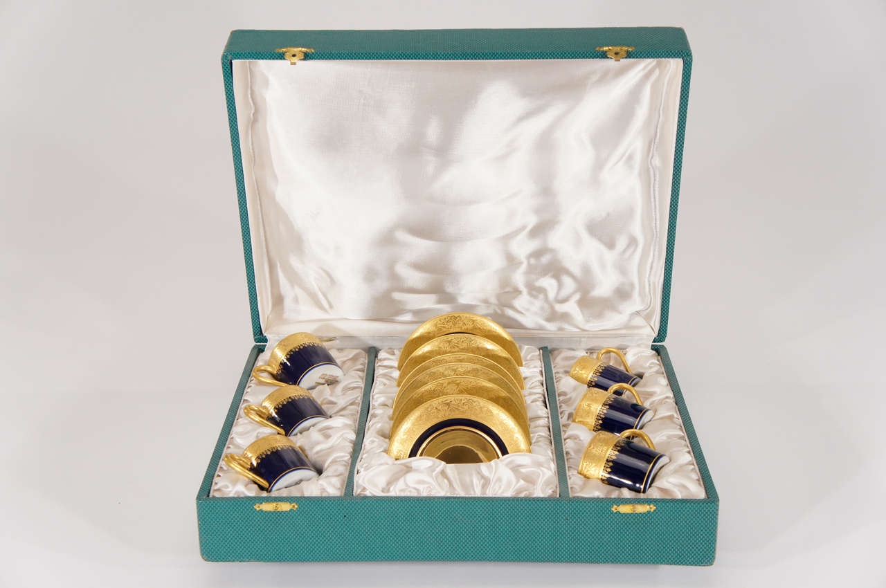 What a gorgeous presentation of 6 perfect demi-tasses/espresso cups and matching saucers, nestled in a satin lined fitted box. Made in France by Limoges, each piece is completely gilded with bright and acid-etched gold decoration with a contrasting