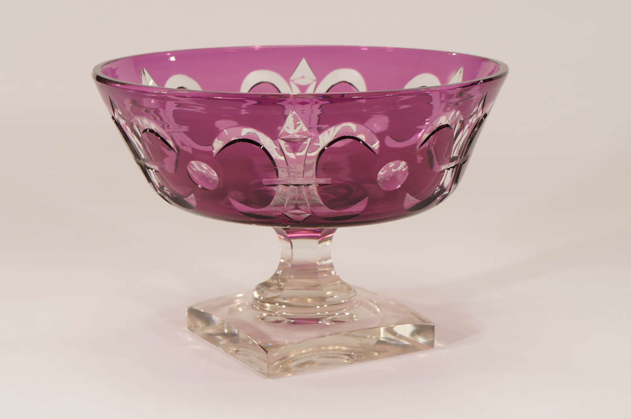 One of Steuben's most elegant centerpieces, this example, shape # 6253 is in amethyst overlay and cut to clear in the 