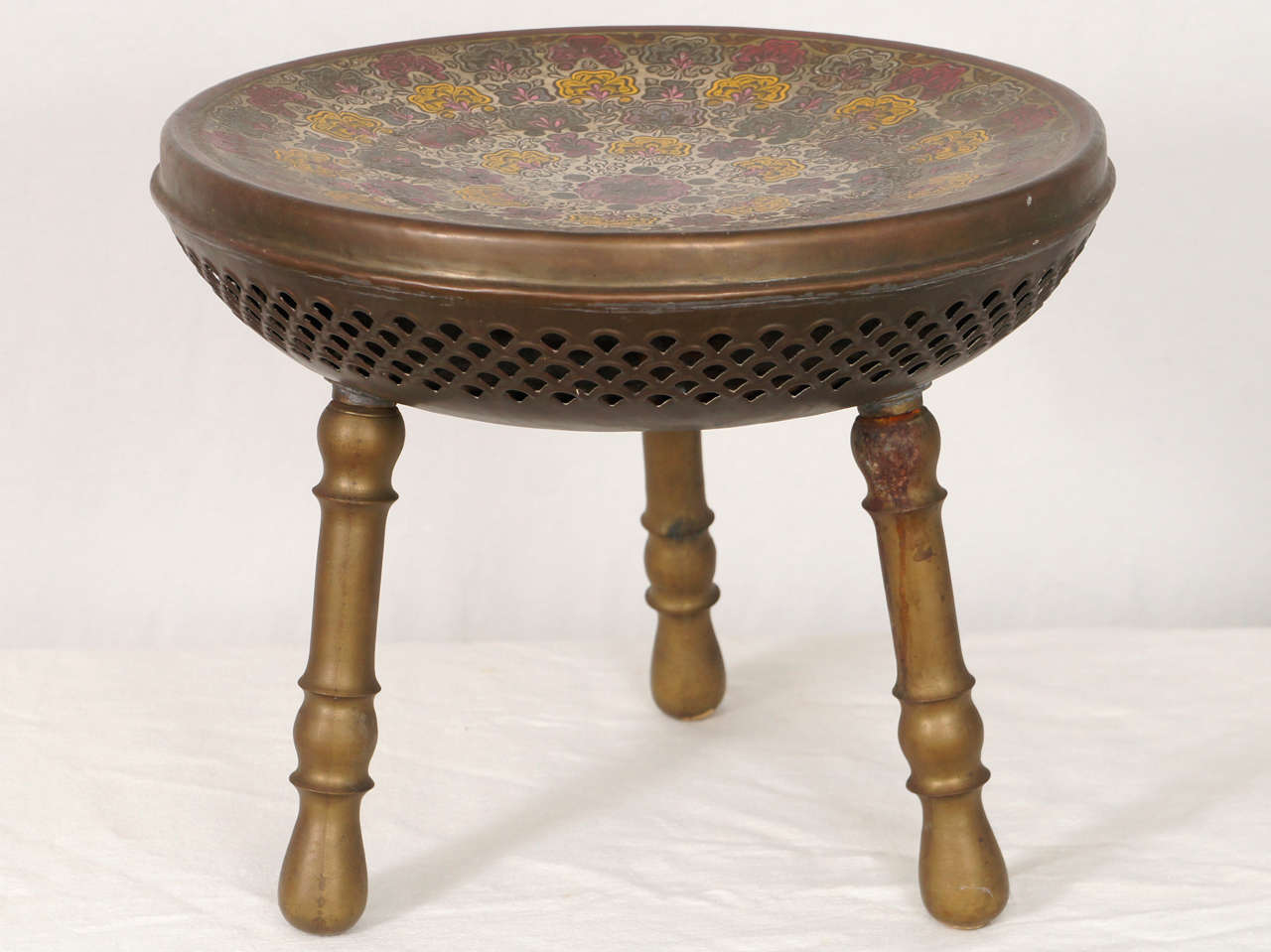 A very nice antique bronze stool with an etched seat and acrylic coloring. these stools were designed as warmers for your feet or seat. however, they are mostly used as decoration.
wonderful clean condition with an aged patina.