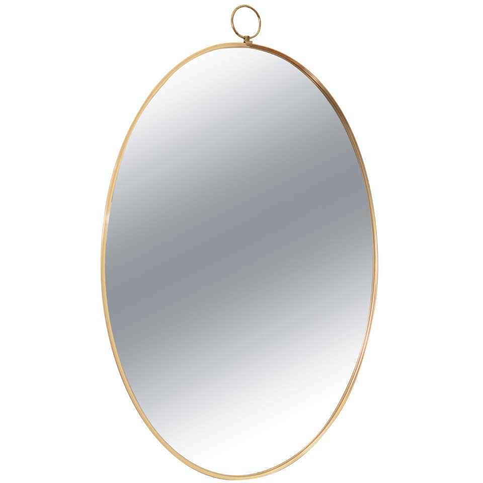 1960s Graceful Oval Brass Mirror with Finial Detail