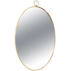 1960s Graceful Oval Brass Mirror with Finial Detail