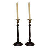 A Pair of Georgian Mahogany and Brass Tall Candlesticks