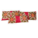 Various throw cushions made from antique silk Ikat