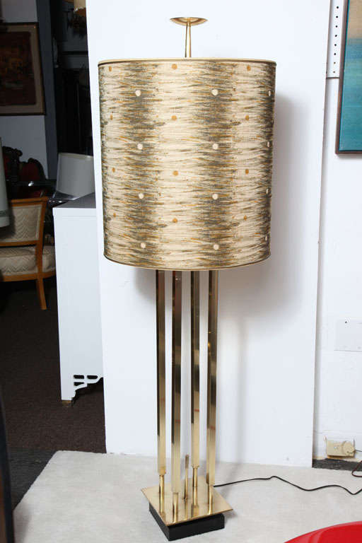 Stunning Stiffel Brass lamp. Brass base set atop black lacquered wood with four square brass bars extending upwards. Comes with the original shade and original finial. Great condition one owner lamp. Shade sits atop the unique glass light diffuser.