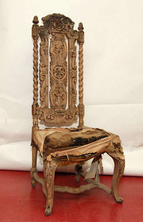 Pair of hand-carved wood chairs, originally painted but now mostly worn but lending it more charm and character.  Seats have original stuffing that will need to be recovered. Please ask us about providing custom upholstery services.<br />
<br